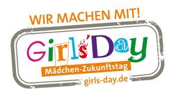 Ein Logo für den "Girls' Day", einen Tag, der den Mädchen gewidmet ist, mit dem Slogan "Wir machen mit!" und einem Link zur Website.